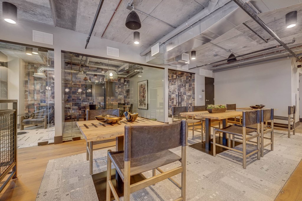 a dining room with wooden tables and chairs