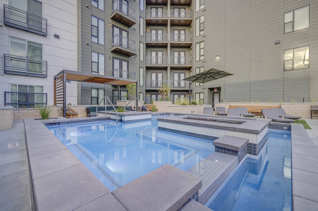 our apartments have a resort style pool and lounge chairs