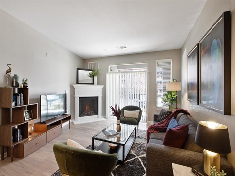 a living room with a couch and a fireplace