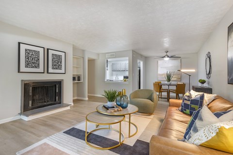 A living room with a fireplace and a couch.