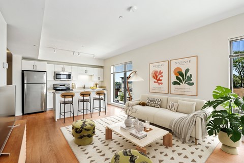 A modern living room with a white couch and a coffee table.