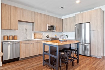 Model Kitchen with Quartz countertops, glass backsplash, and GE Appliance - Photo Gallery 2