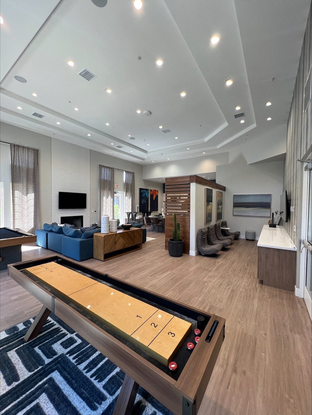 Renovated Clubhouse Shuffleboard and View of Lounge Area