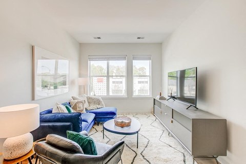 a living room with a couch and a tv