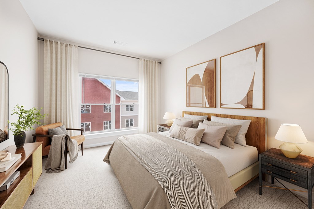 a bedroom with a large bed and a large window