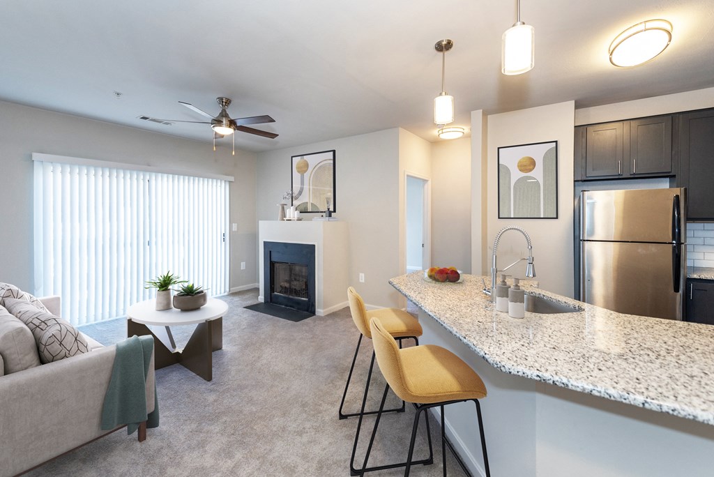 Spacious living room with a fireplace and breakfast bar
