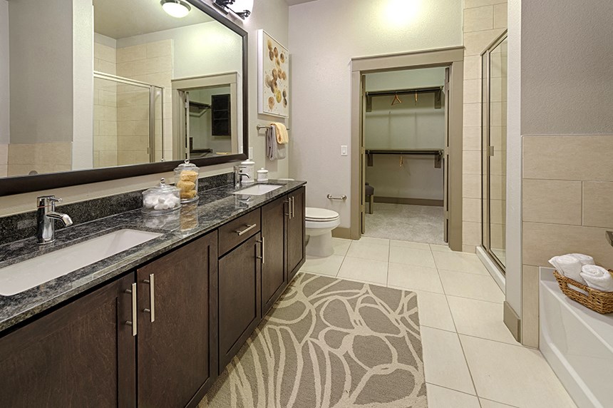 a bathroom with a sink and a toilet and a shower