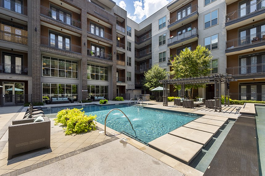 a swimming pool in the middle of an apartment building