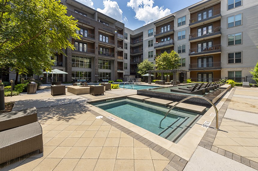 our apartments have a large pool with lounge chairs and umbrellas