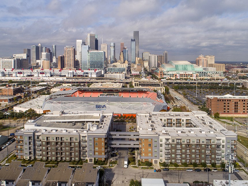 an aerial view of the staples center and the downtown skyline