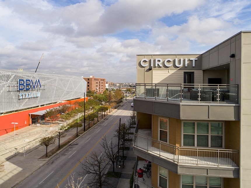 a building with a sign on the side of a street