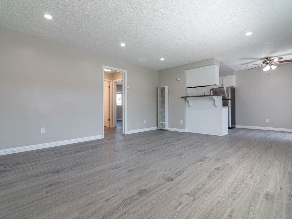 a room with a bunch of colorful lights on the floor at Citrus Court Apartments, California