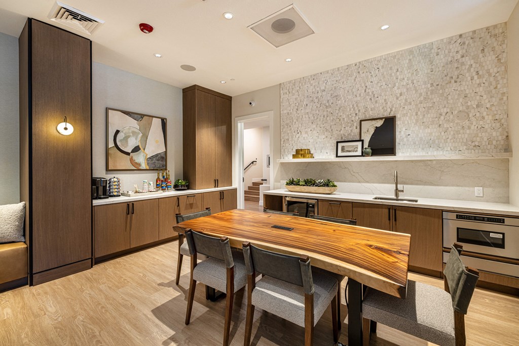 a kitchen and dining room with a wooden table
