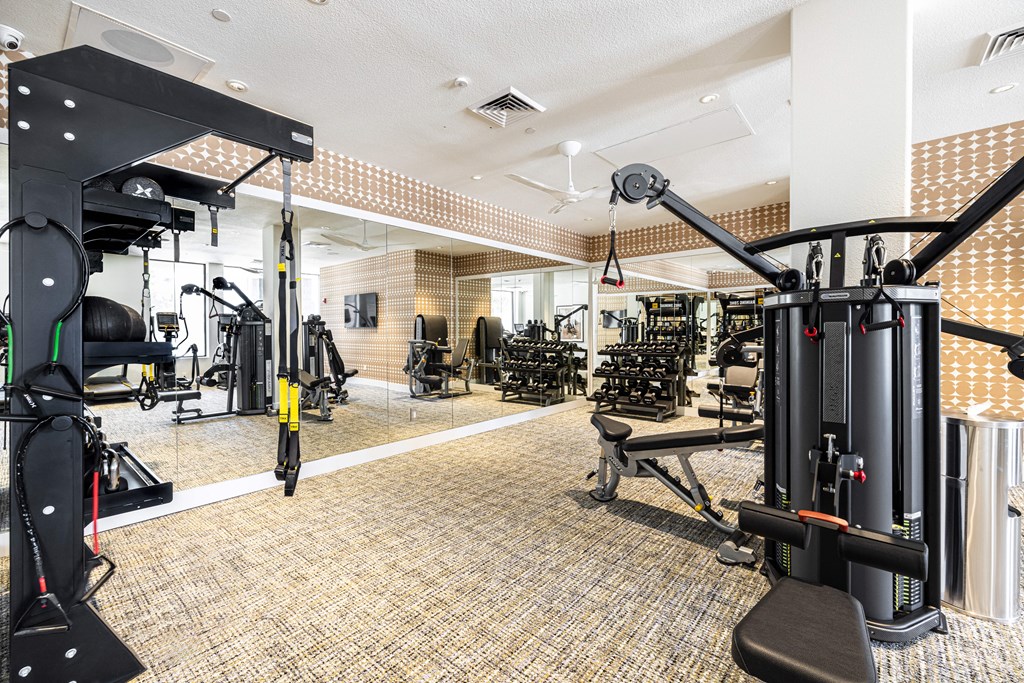 a gym with weights machines and other exercise equipment