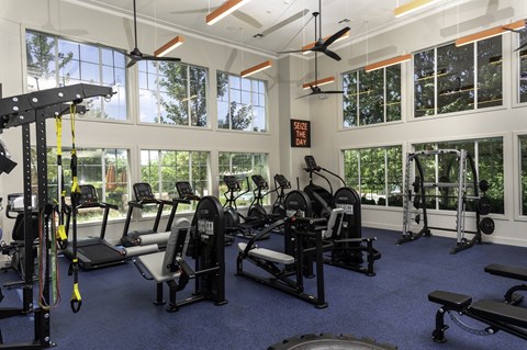 a room filled with lots of different types of exercise equipment