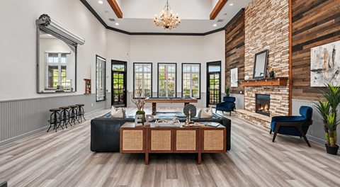 A modern living room with a fireplace and a large mirror on the wall.