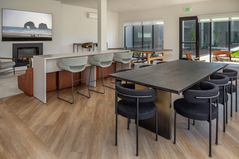 A conference room with a long table and chairs.