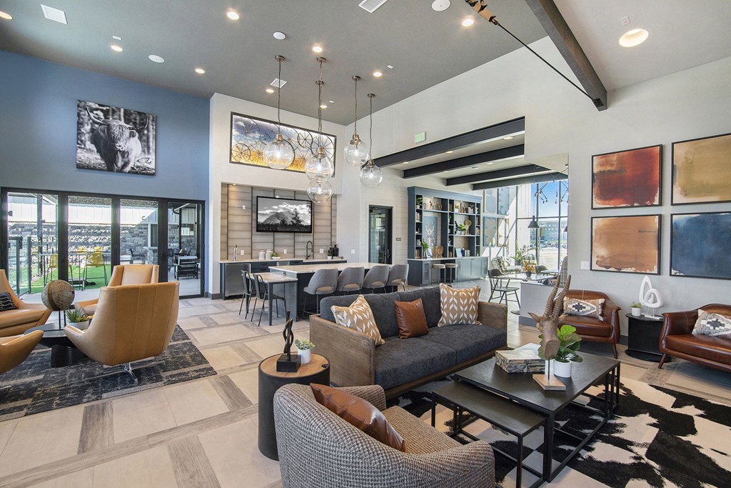 a living room with couches and chairs and a table