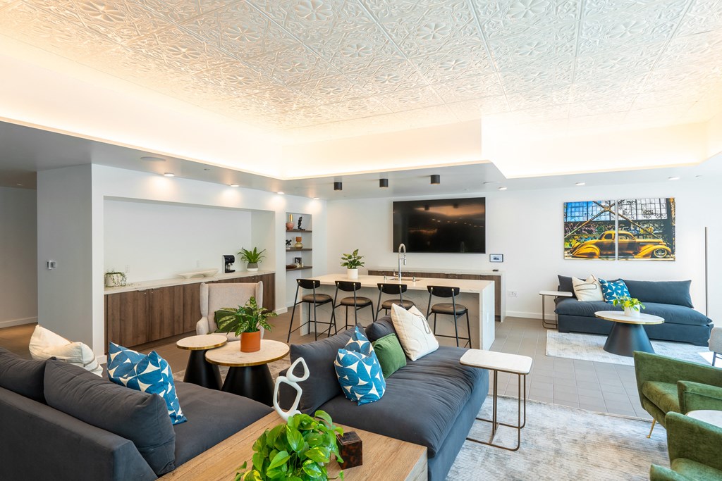 a living room filled with furniture and a large window