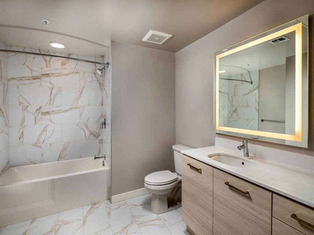 a bathroom with a sink toilet and a shower
