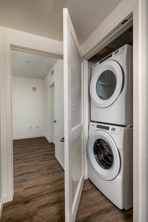 a washing machine and dryer in a small laundry room
