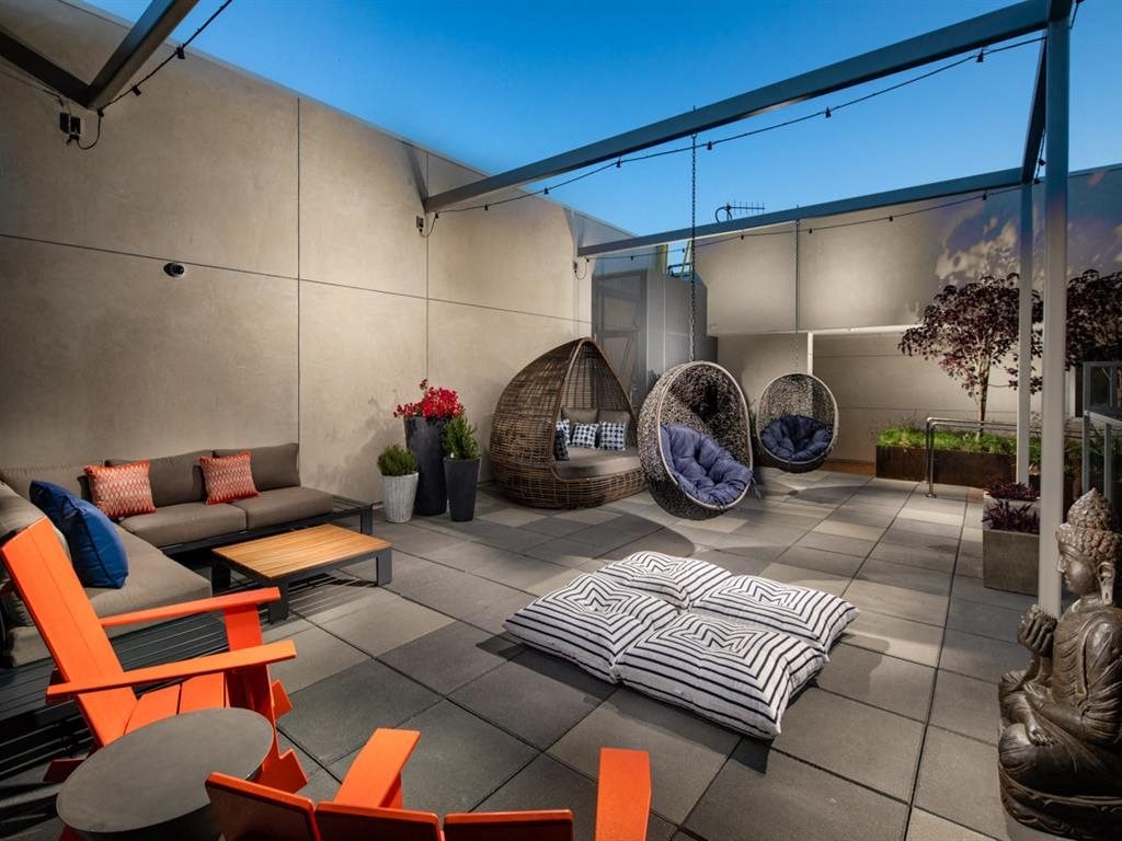 a living room with couches and chairs and a patio