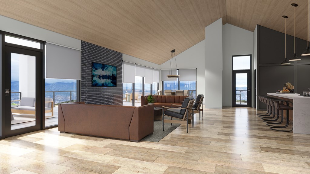 A modern living room with a large window overlooking the city.
