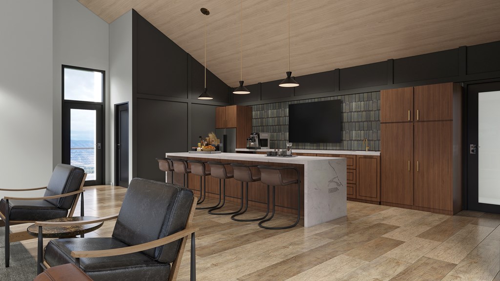 A modern kitchen with a bar area and seating.