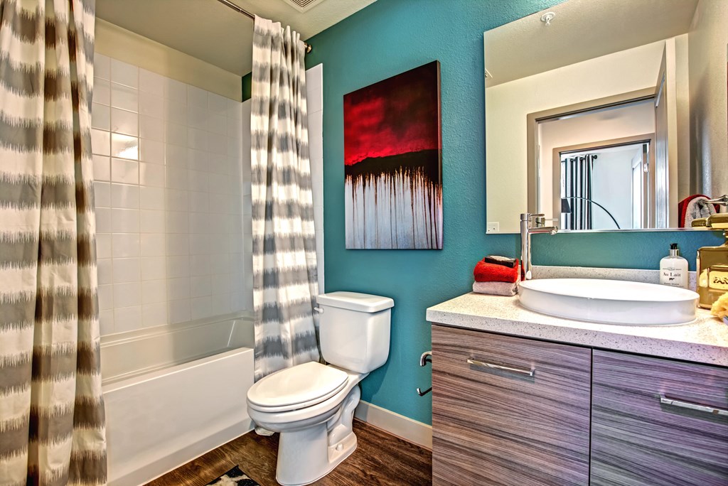 a bathroom with a toilet sink and bathtub