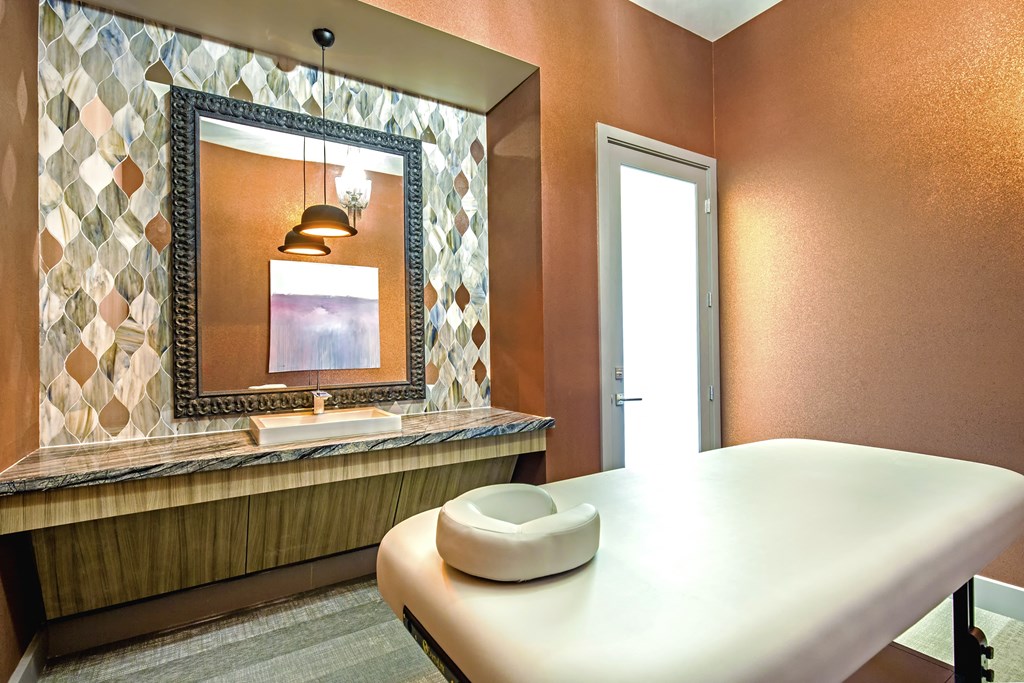 a room with a table and a mirror