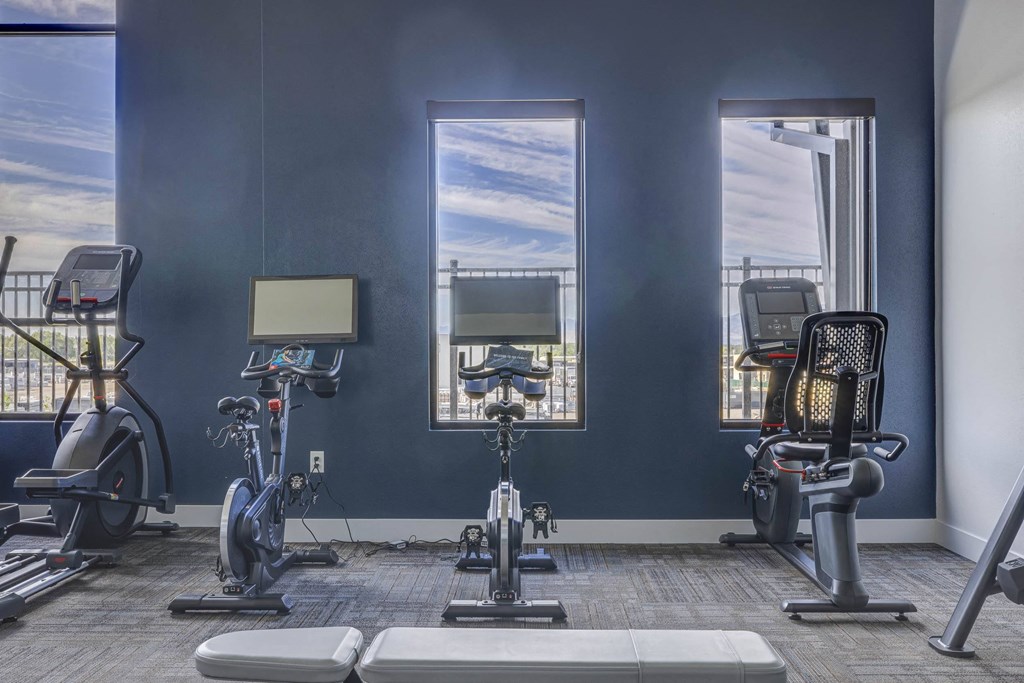 a gym with three treadmills and exercise bikes at Copper 87, West Jordan, UT