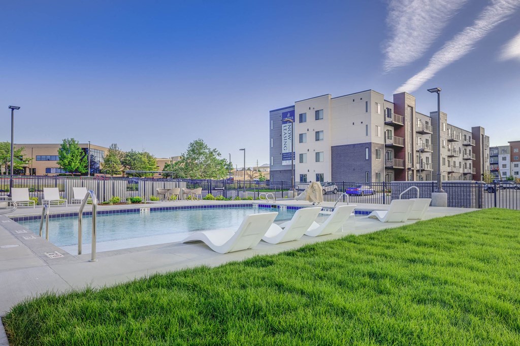 take a dip in the pool at the bradley braddock road station apartments at Copper 87, West Jordan Utah
