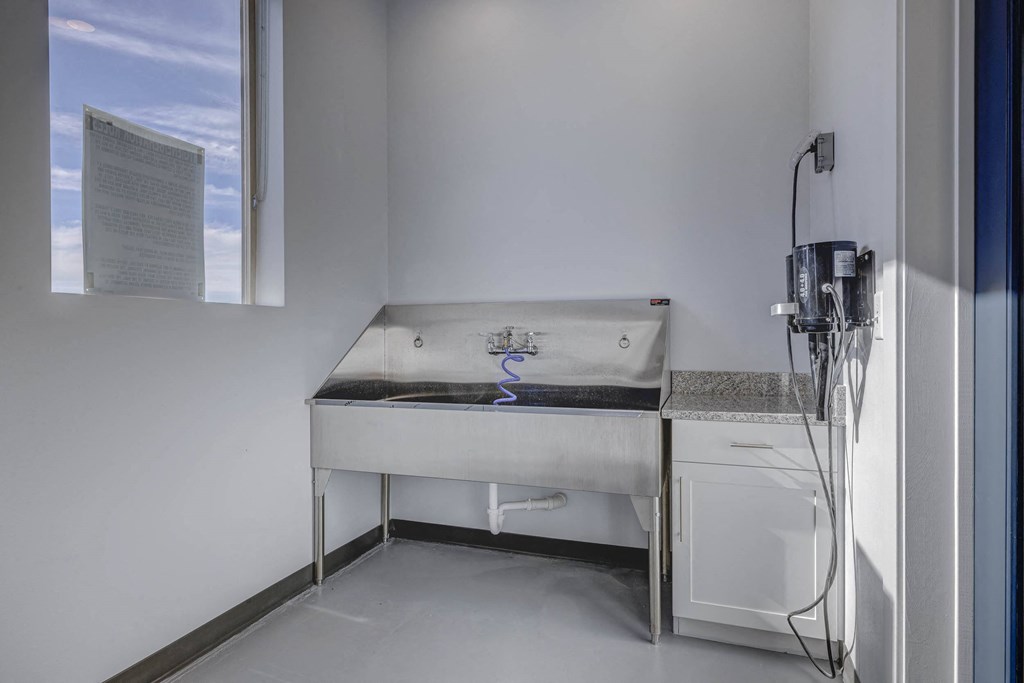 a kitchen with a sink and a window in a 555 waverly unit at Copper 87, West Jordan Utah