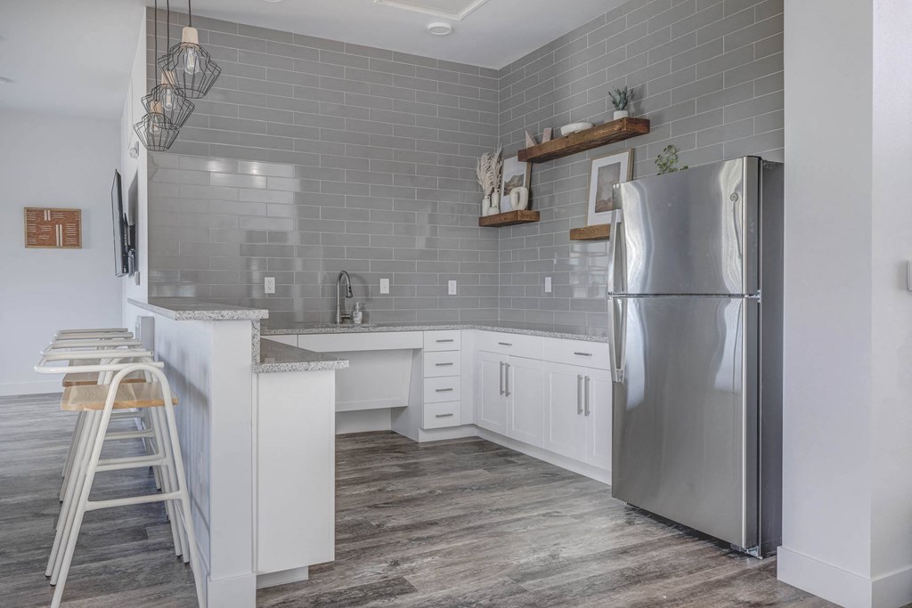a kitchen with white cabinets and stainless steel appliances at Copper 87, West Jordan, 84088