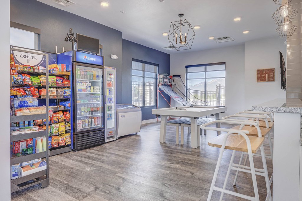 a room with a table and chairs and a vending machine at Copper 87, West Jordan, UT 84088