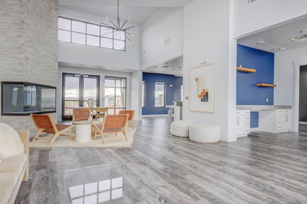 a living room with white walls and a blue accent wall at Copper 87, Utah