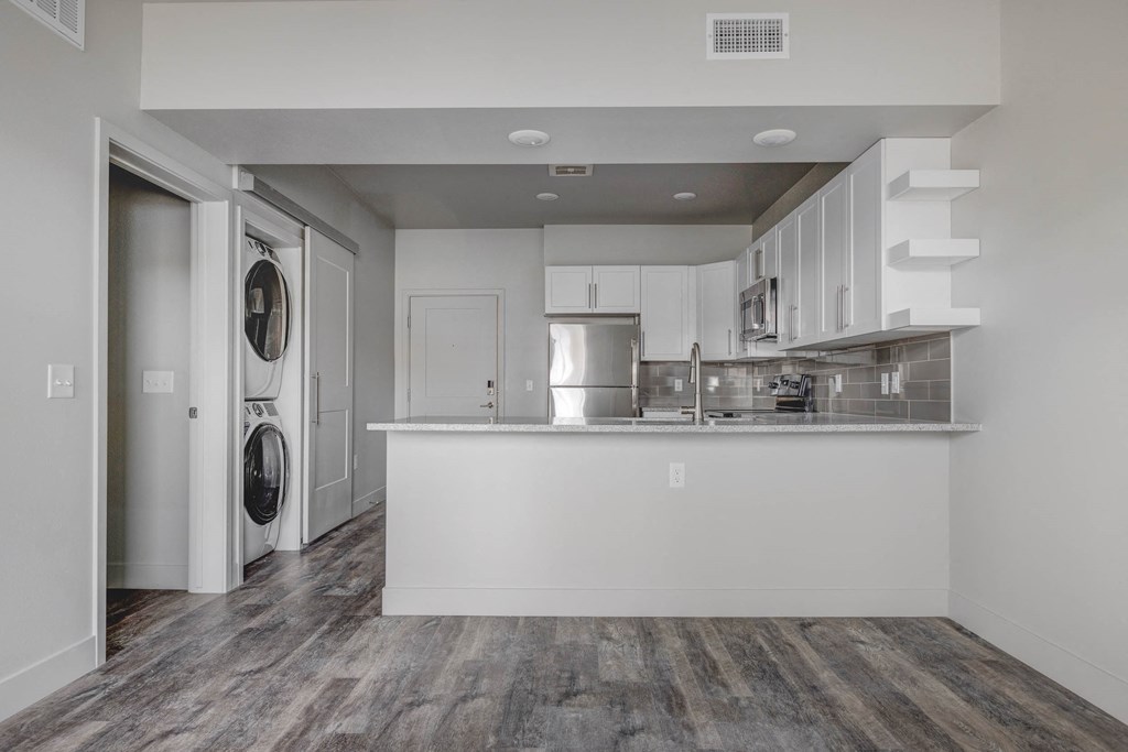 a kitchen with white cabinetry and a white counter top at Copper 87, West Jordan, 84088