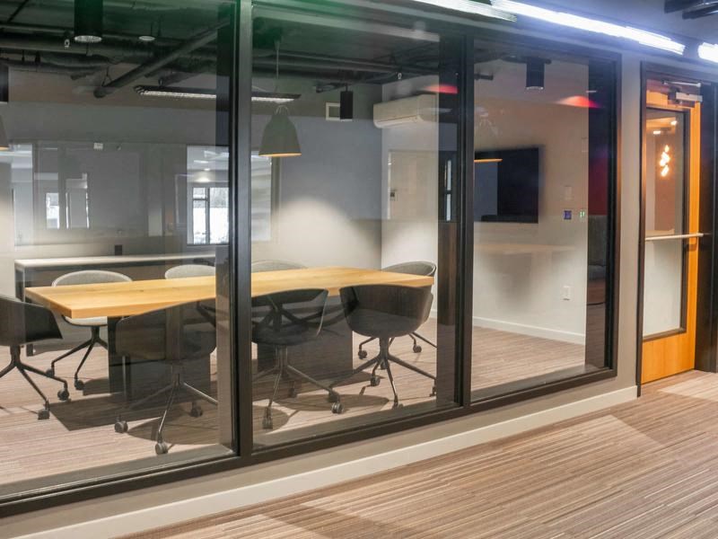 A conference room with a wooden table and chairs.at Axle, Seattle, WA
