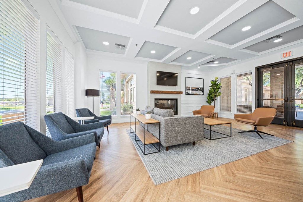 a living room with couches and chairs and a fireplace
