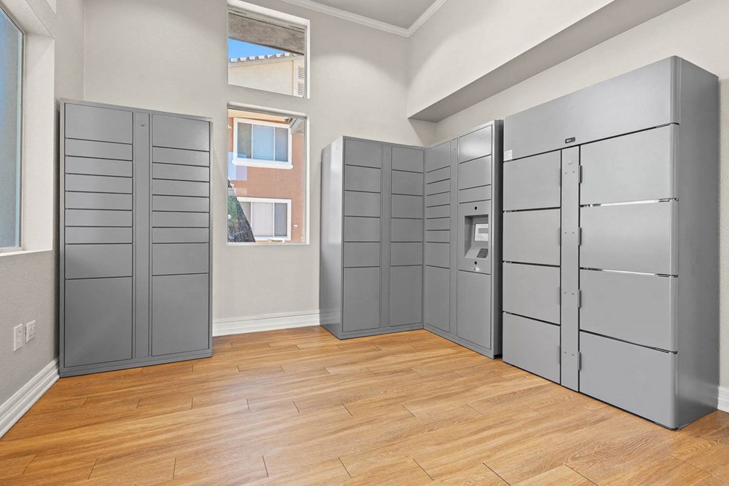 an empty room with several closets and a window