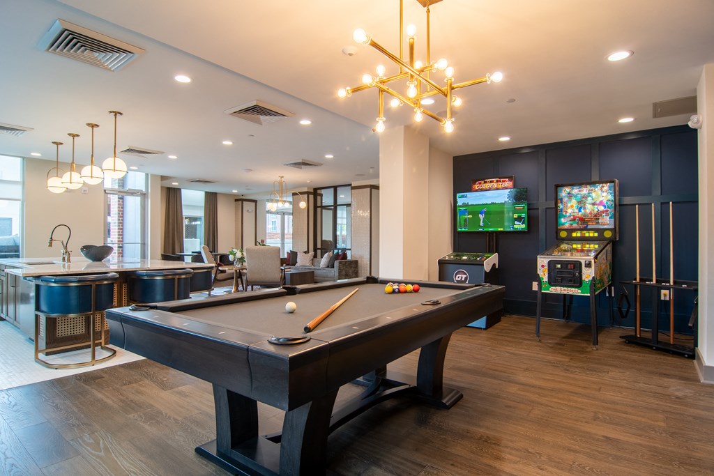 a games room with a pool table and a foosball table