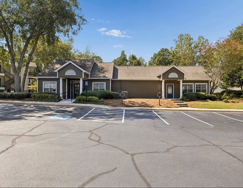 A building with a parking lot in front of it.