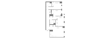 A floor plan of a building with multiple rooms and corridors.