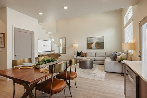 Dining area with table and chairs at Rise new townhomes in South Jordan, Utah.