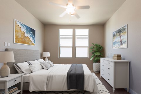 a bedroom with a large bed and a ceiling fan