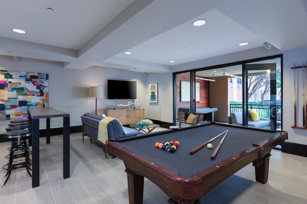 resident lounge with large screen tv and billiards