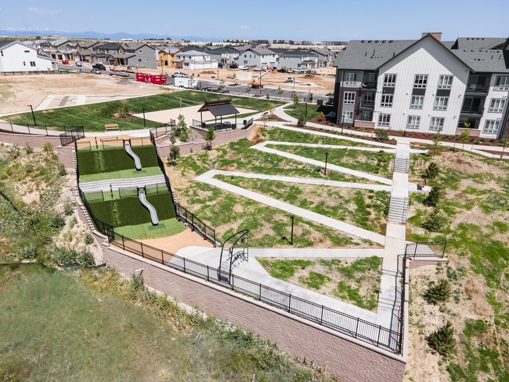 A park with a slide and a playground.