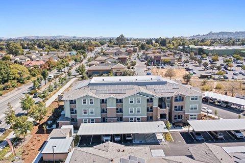 an aerial view of an apartment building in a city