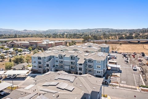 an aerial view of an apartment building in a city