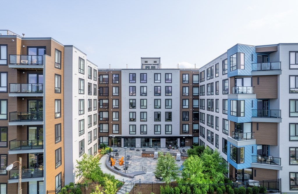 an aerial view of 1550 on the Charles apartment building with a courtyard in the middle